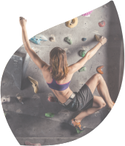woman climbing on indoor climbing wall