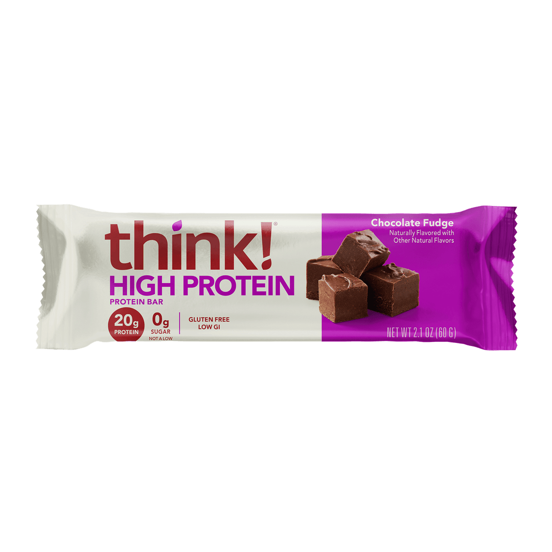 Protein bar packaging with "think! High Protein" in bold letters. Chocolate fudge flavor, gluten-free, 20g protein, 0g sugar. Wrapper is white and purple.