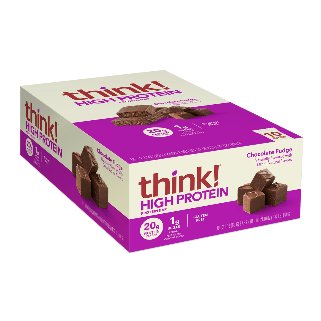 Box of think! High Protein Bars in Chocolate Fudge flavor with purple and beige design. Highlights 20g protein, 1g sugar, gluten-free. Displays bar images.
