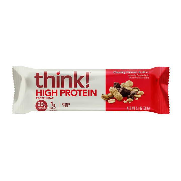 Packaging of a "think! High Protein" bar, chunky peanut butter flavor. It shows peanuts and chocolate, highlighting 20g protein, 1g sugar, and gluten-free.