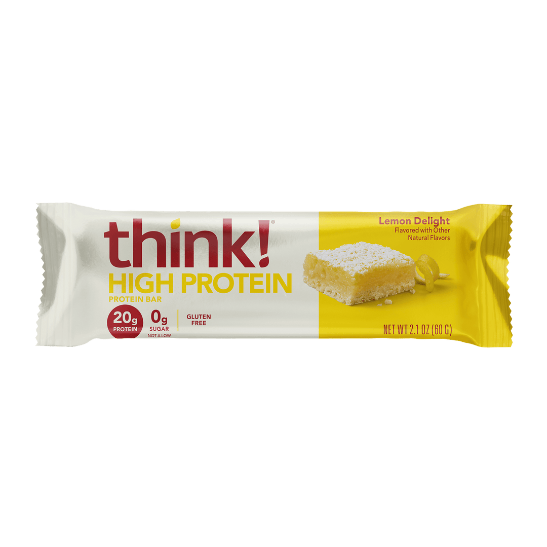 A protein bar wrapper with the brand "think!" in bold red letters. It reads "High Protein" and "Lemon Delight" flavor on a yellow background, highlighting 20g protein and 0g sugar.