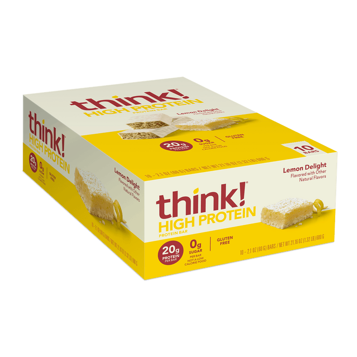 Yellow and white box of think! High Protein Lemon Delight bars with lemon slice and coconut imagery. Text highlights 20g protein, 0g sugar, gluten-free.