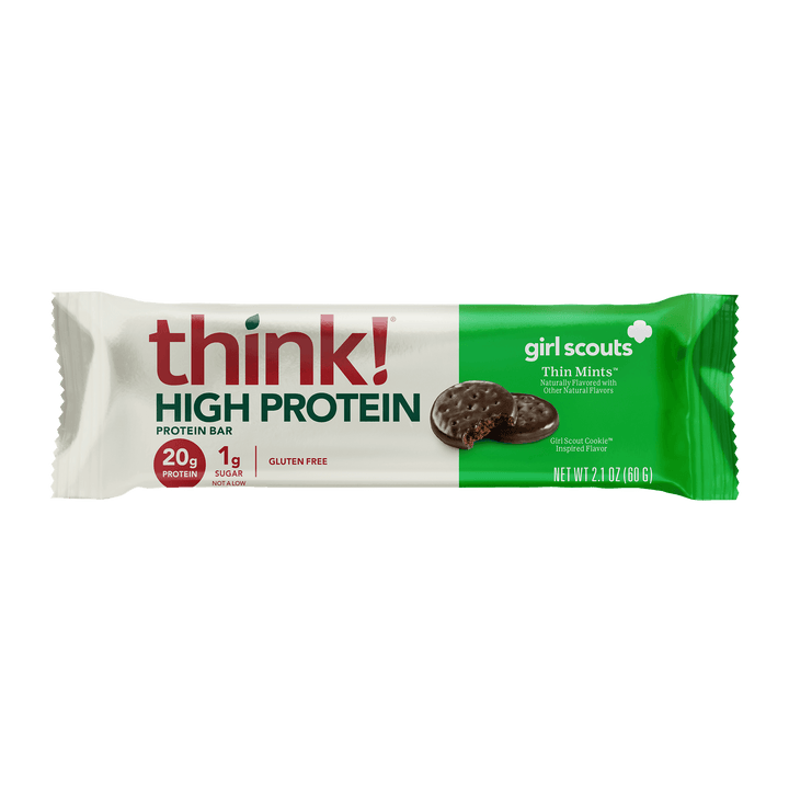 Protein bar wrapper with "think! High Protein" text, featuring Girl Scouts Thin Mints design. Nutritional highlights include 20g protein, 1g sugar.