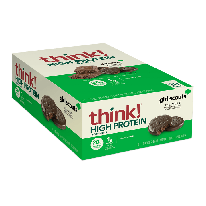 Box of Think! High Protein bars in Girl Scouts Thin Mints flavor, displaying 20g protein, 1g sugar, gluten-free, with images of chocolate mint cookies.